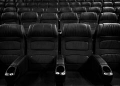 grayscale photo of empty seats