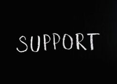 support lettering text on black background
